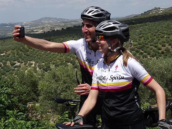 Selfie time, olive yards, happy cyclists