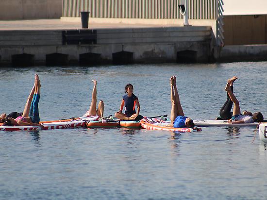 Sup Yoga in calm waters of Valencia 