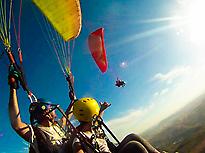 Tandem Paragliding Flight in Hig...